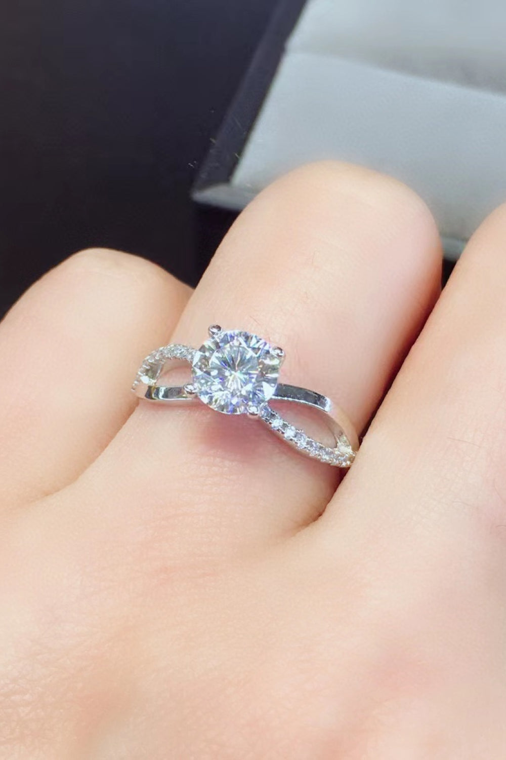 Silver crisscross ring with diamond halo and accent stones