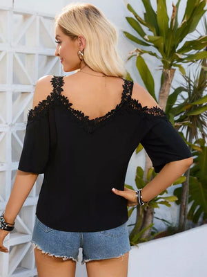 Black cold shoulder maternity shirt with lace trim and short sleeves.