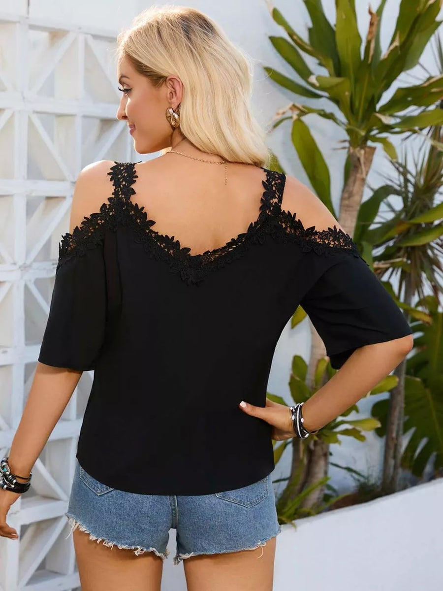 Black cold shoulder maternity shirt with lace trim and short sleeves.