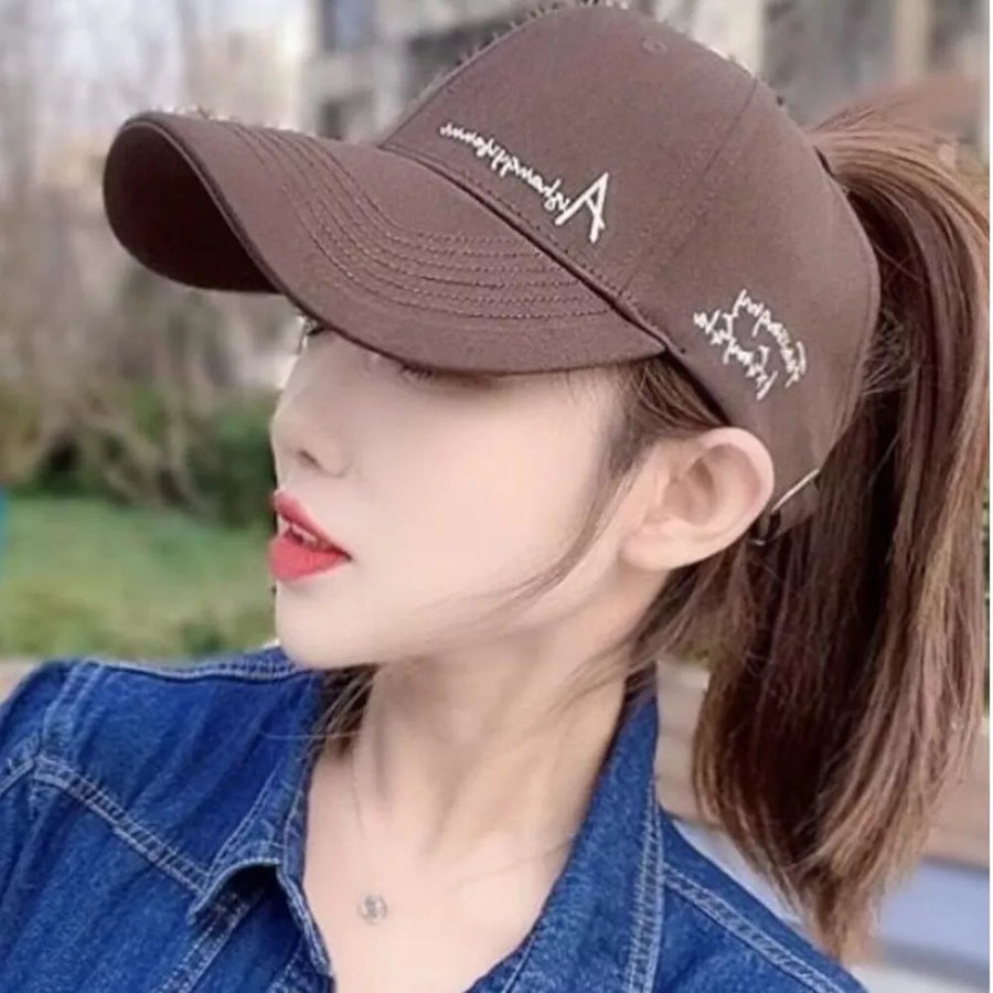 Brown baseball cap with white embroidered letter A and script detail