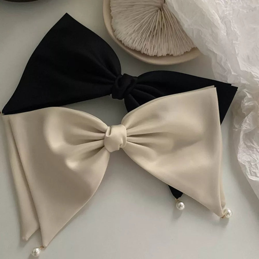 hair clip in black featuring bow detail and not applicable fit