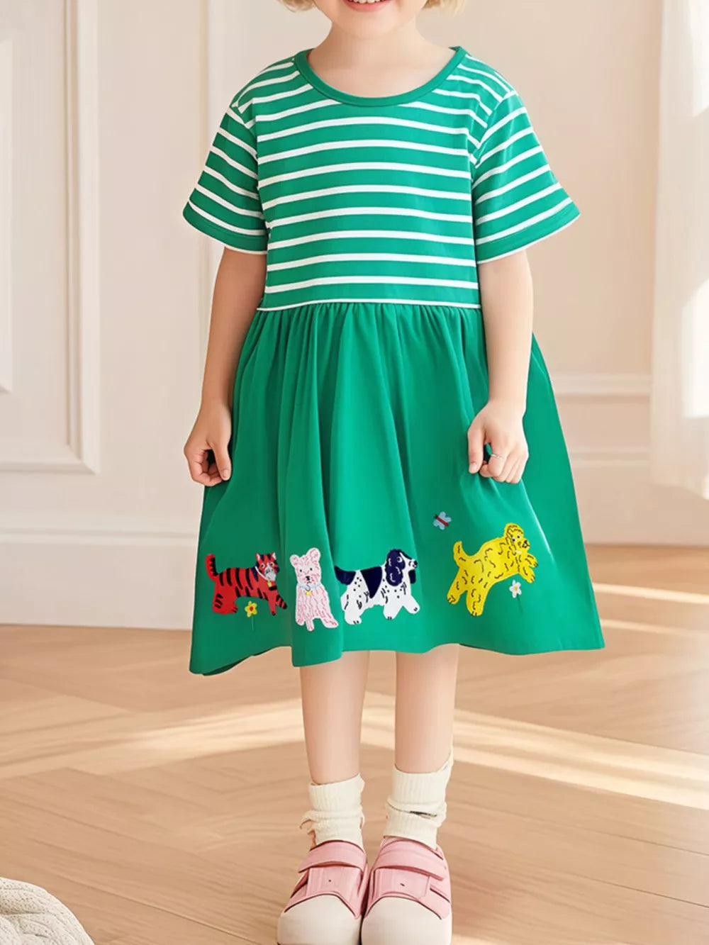 Green striped toddler dress with embroidered animals on skirt