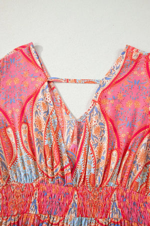 Paisley print boho dress with V-neck, short sleeves, and smocked waist detail.