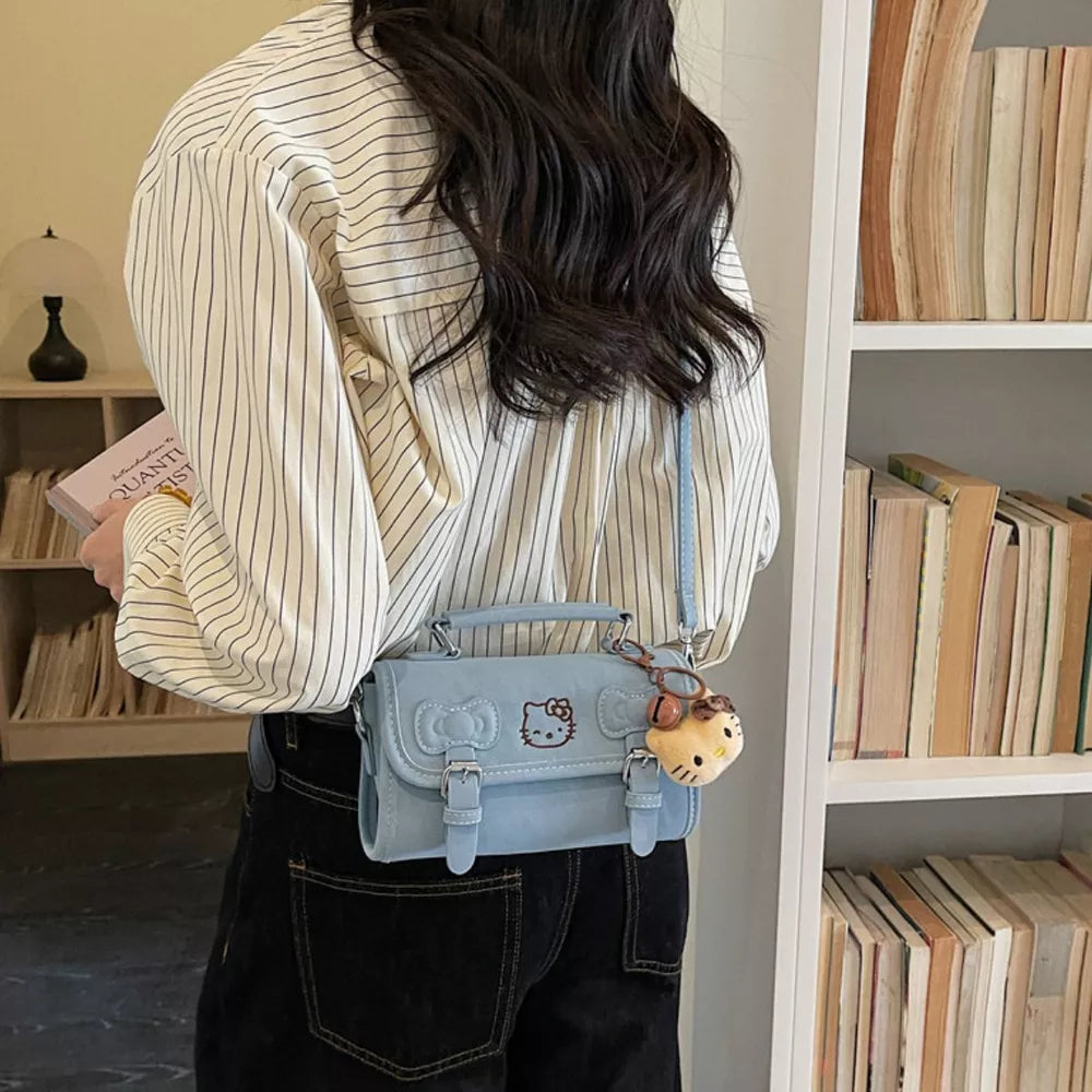 crossbody bag in light blue featuring double buckle and boxy fit