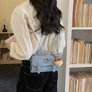 crossbody bag in light blue featuring double buckle and boxy fit