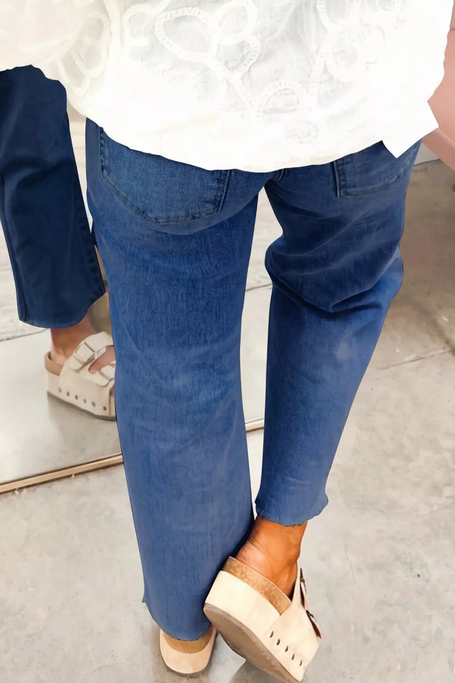 Maternity jeans in dark blue denim with a straight leg cut and frayed hem.