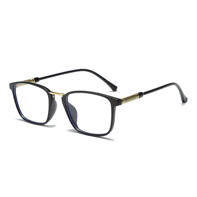 Black acetate anti-light glasses with gold temple accents and clear lenses.