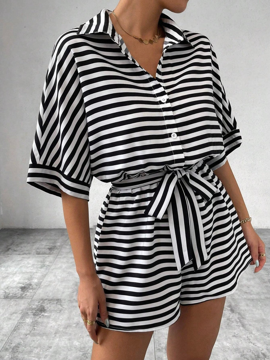 Black and white striped shirt romper with self-tie belt and button front.