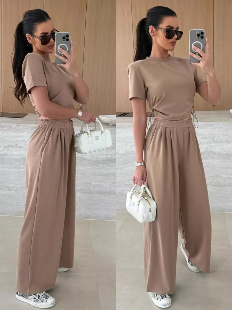Mocha crop top and wide-leg pants set with adjustable side ties and drawstring waist.