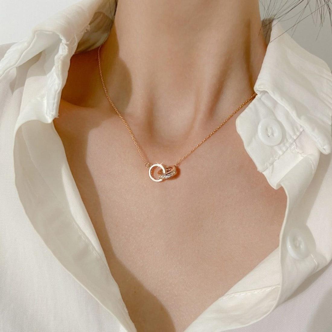 Rose gold double circle pendant necklace with crystal accents