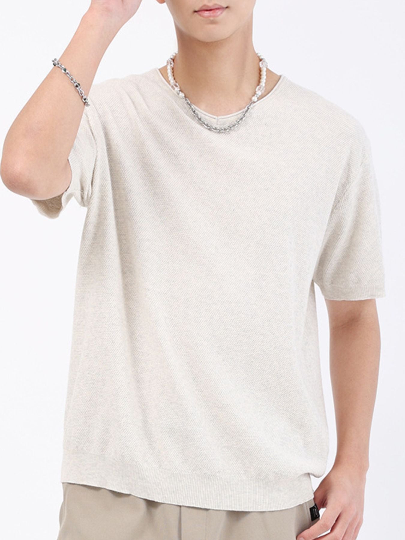 Men's cream casual knit t-shirt with short sleeves and a textured weave.