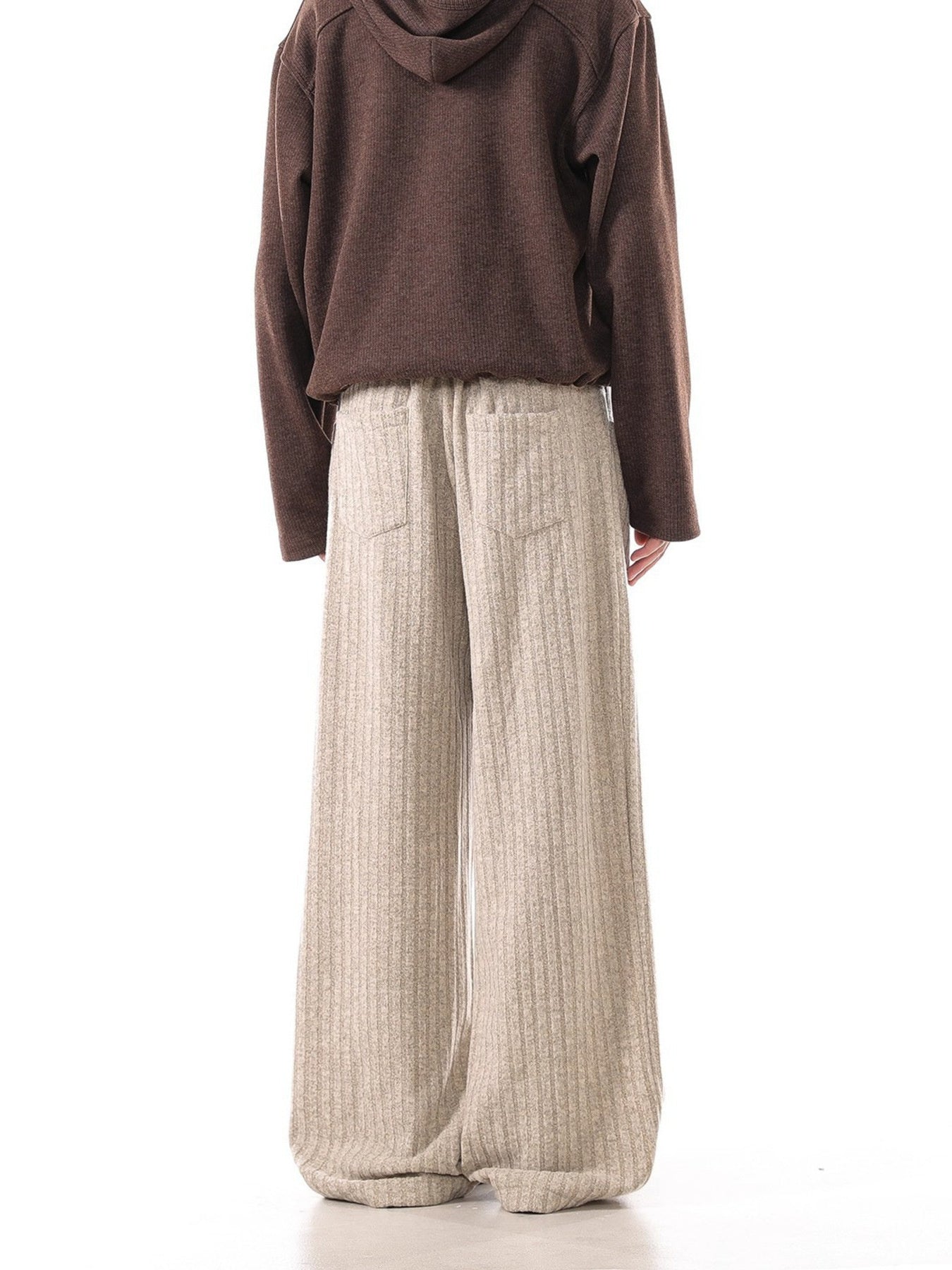 Khaki ribbed sweatpants with wide legs and back pockets.