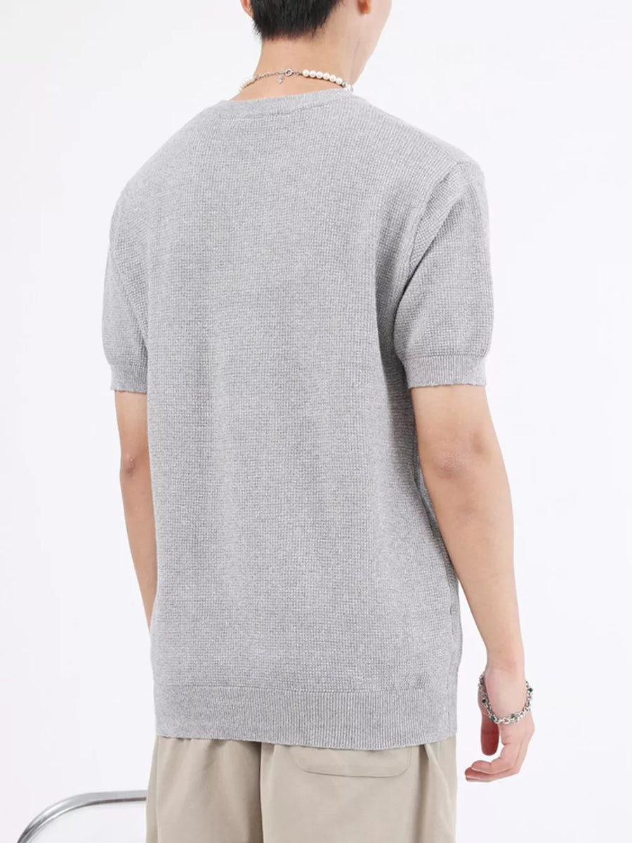 Men's Melange Gray knit henley t-shirt with short sleeves and textured fabric.