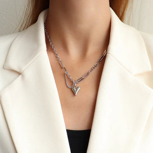 Silver heart drop chain link necklace with delicate chain accent