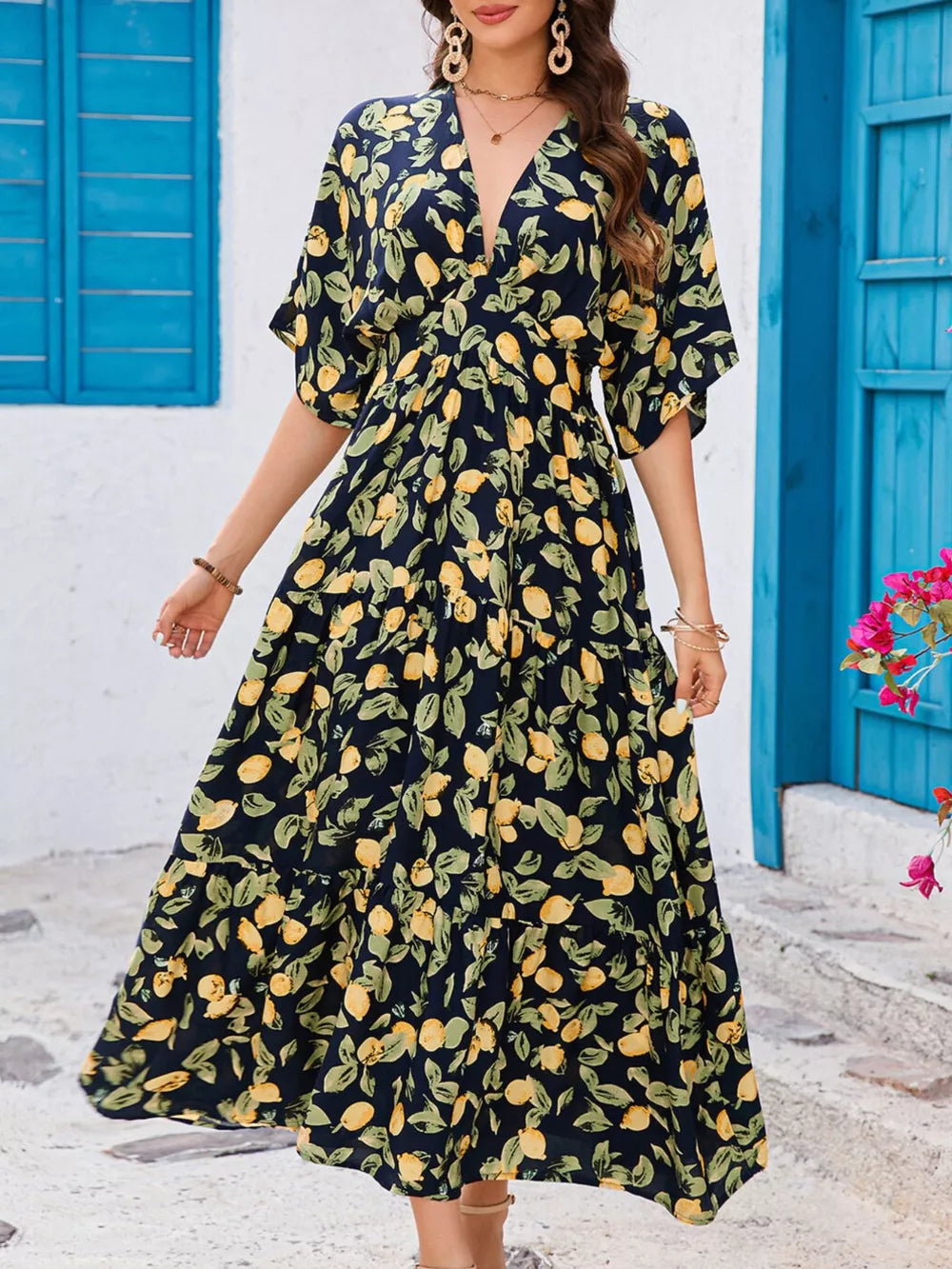 Lemon leaf print midi dress in black forest with V-neck and flutter sleeves.