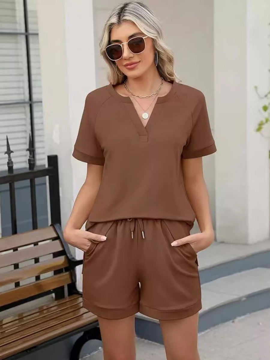 Brown two-piece set with drawstring shorts and V-neck top with pockets