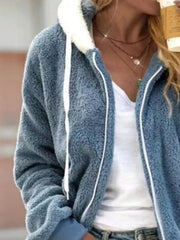 Blue fleece zip-up hoodie with white trim and drawstring, worn over a white tee.