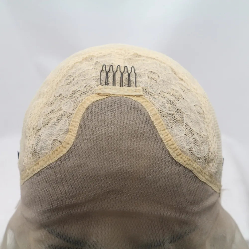 Ombre pink blunt cut wig cap construction with combs and lace detail.