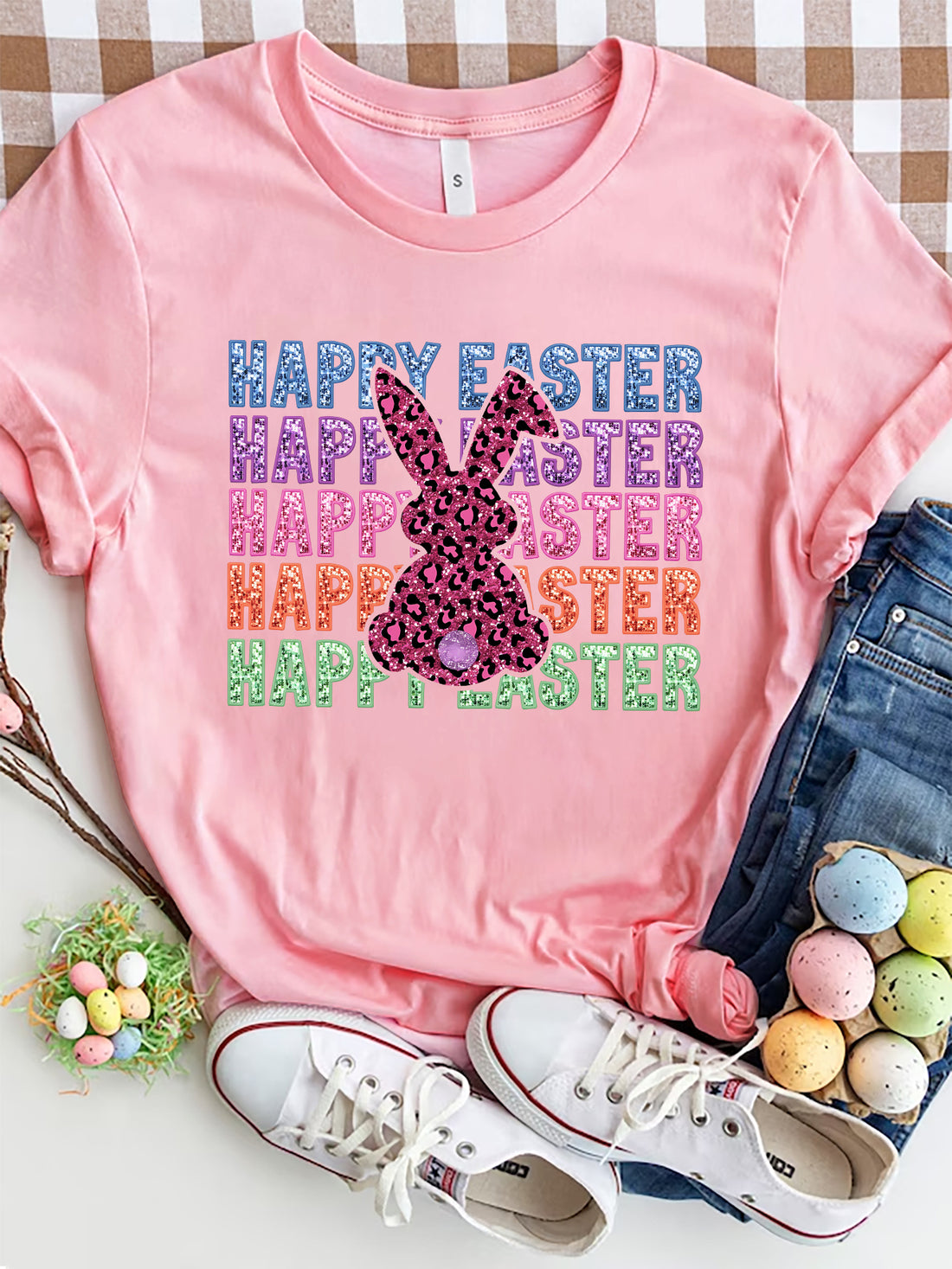 Pink t-shirt with leopard print bunny graphic and glitter "Happy Easter" text.