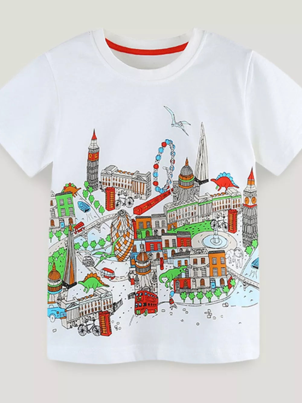 White t-shirt with a colorful London cityscape and dinosaur print.