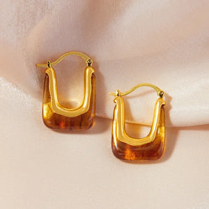 Gold geometric hoop earrings with amber resin inlay