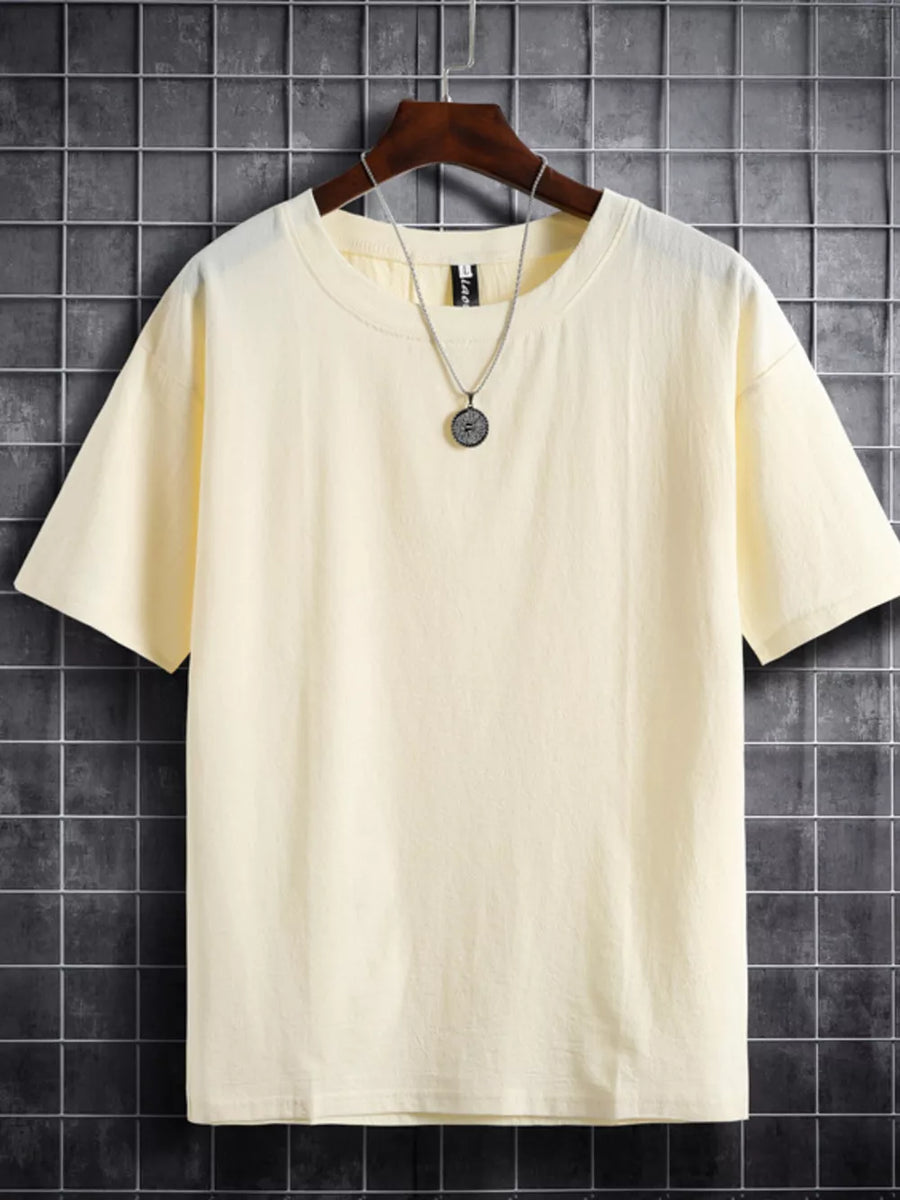Beige cotton crew neck t-shirt with short sleeves and a relaxed fit.