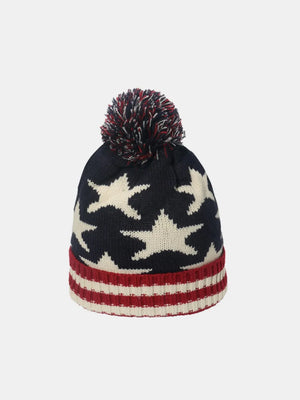 Knit beanie with stars and stripes pattern, pom pom, and ribbed cuff.