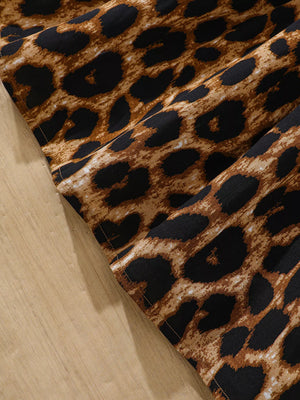 Baby leopard print dress with ruffle collar detail in apricot.