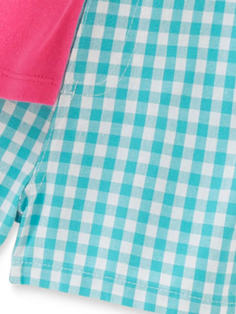 Toddler pajama set with pink cap sleeves and turquoise gingham shorts.