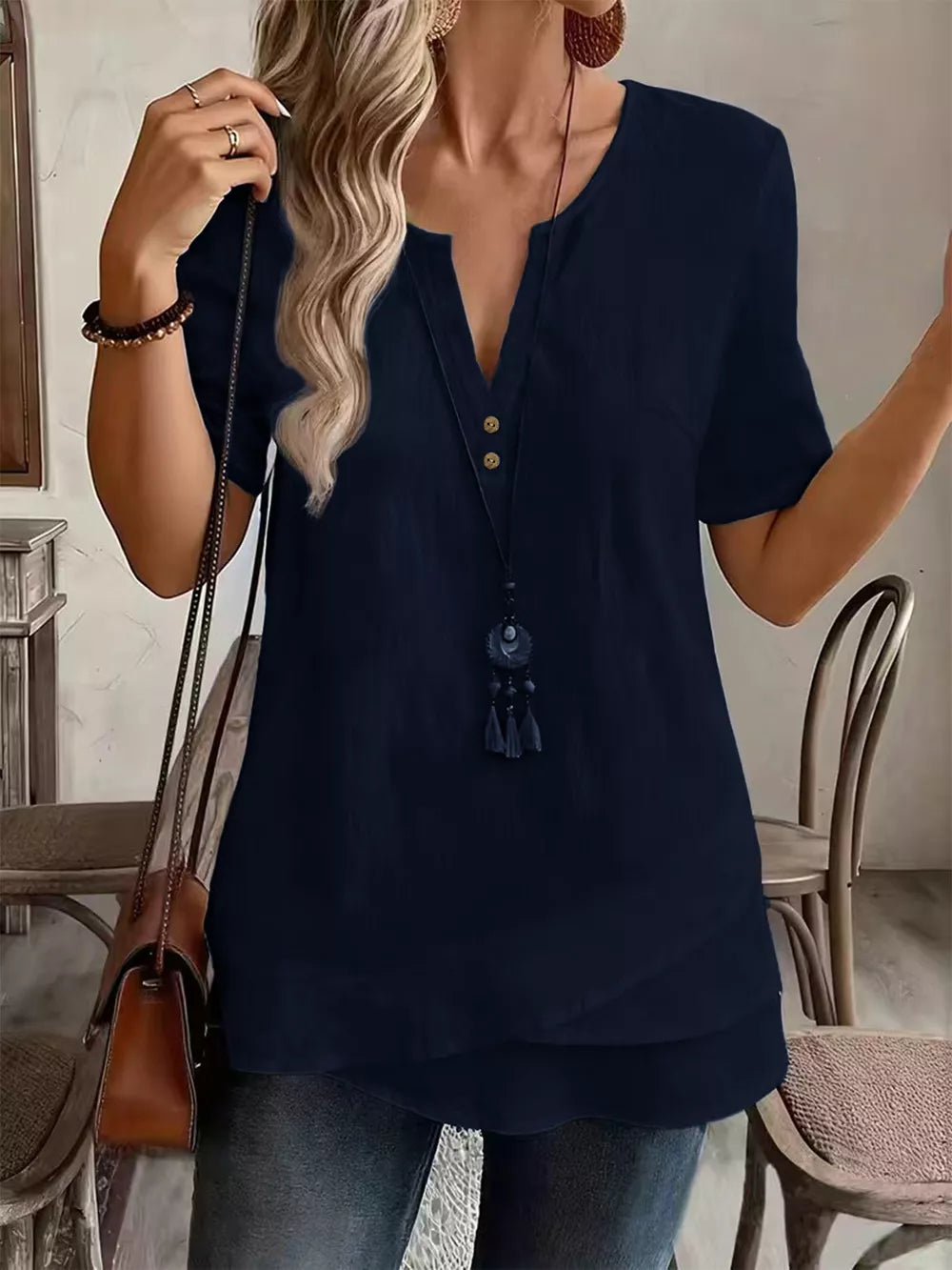 Orange blouse with decorative buttons and short sleeve
