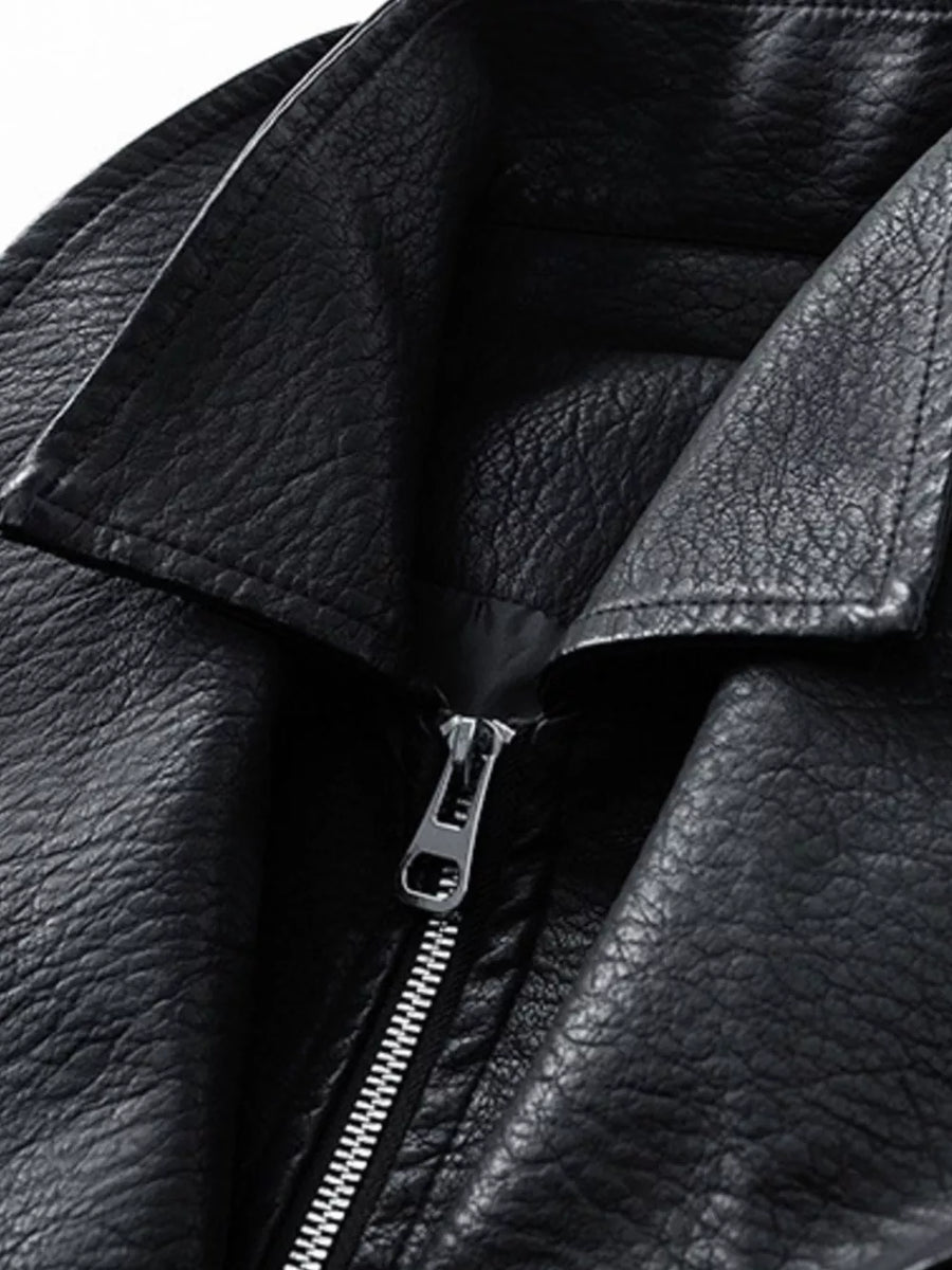 Black faux leather moto jacket with a silver zipper and lapel collar.