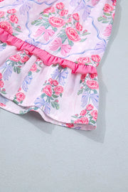 Floral tiered ruffle dress with pink roses and blue bows on a white background.