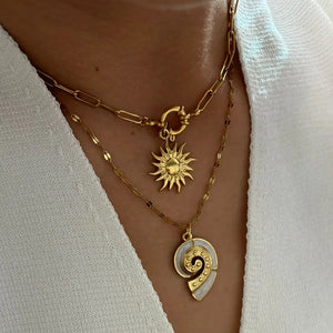 cream necklace featuring layered and motif