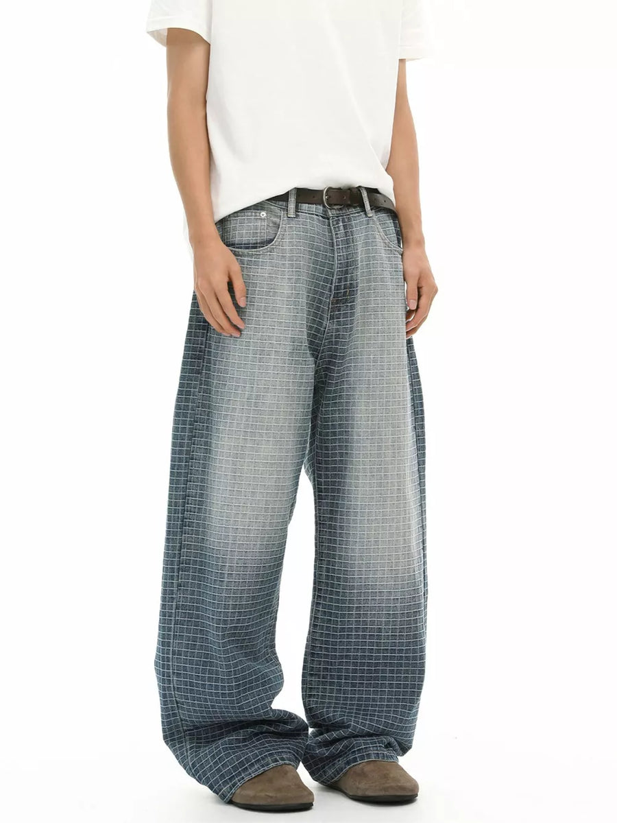 Men's relaxed-fit jeans in blue plaid cotton with a buttoned waist.