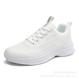 White knit performance runners with textured detail and lace-up closure.