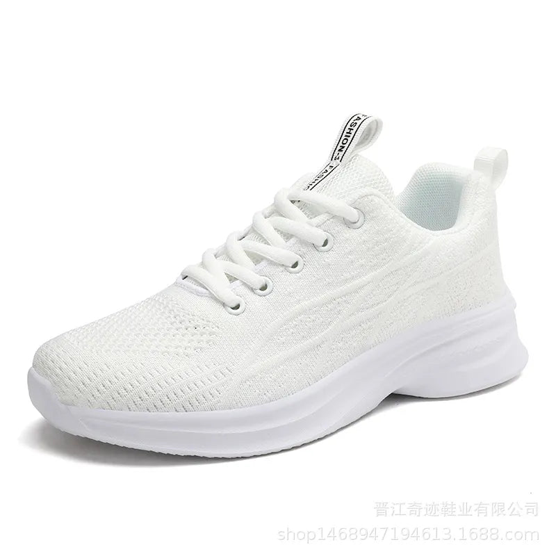 White knit performance runners with textured detail and lace-up closure.