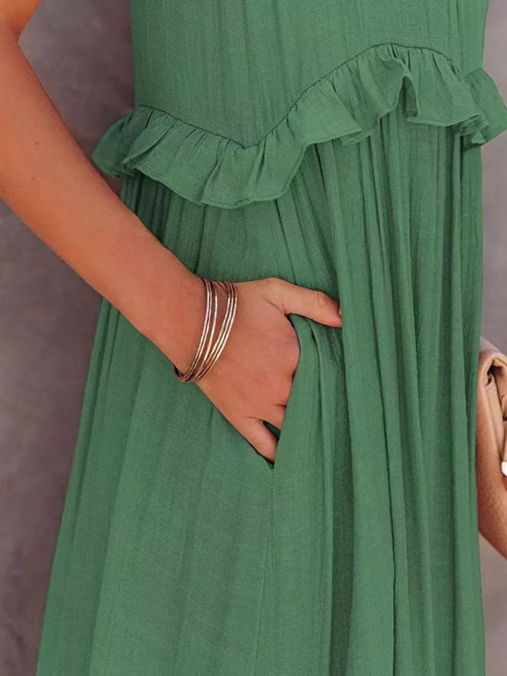 Green ruffled maxi dress with pockets, polyester fabric.