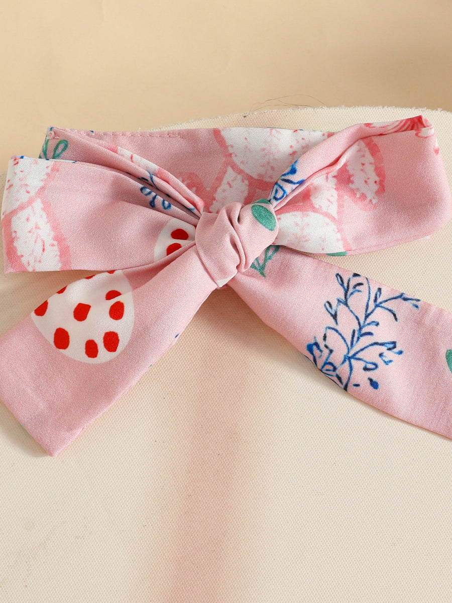 Pink baby headband with bow detail and Easter egg print