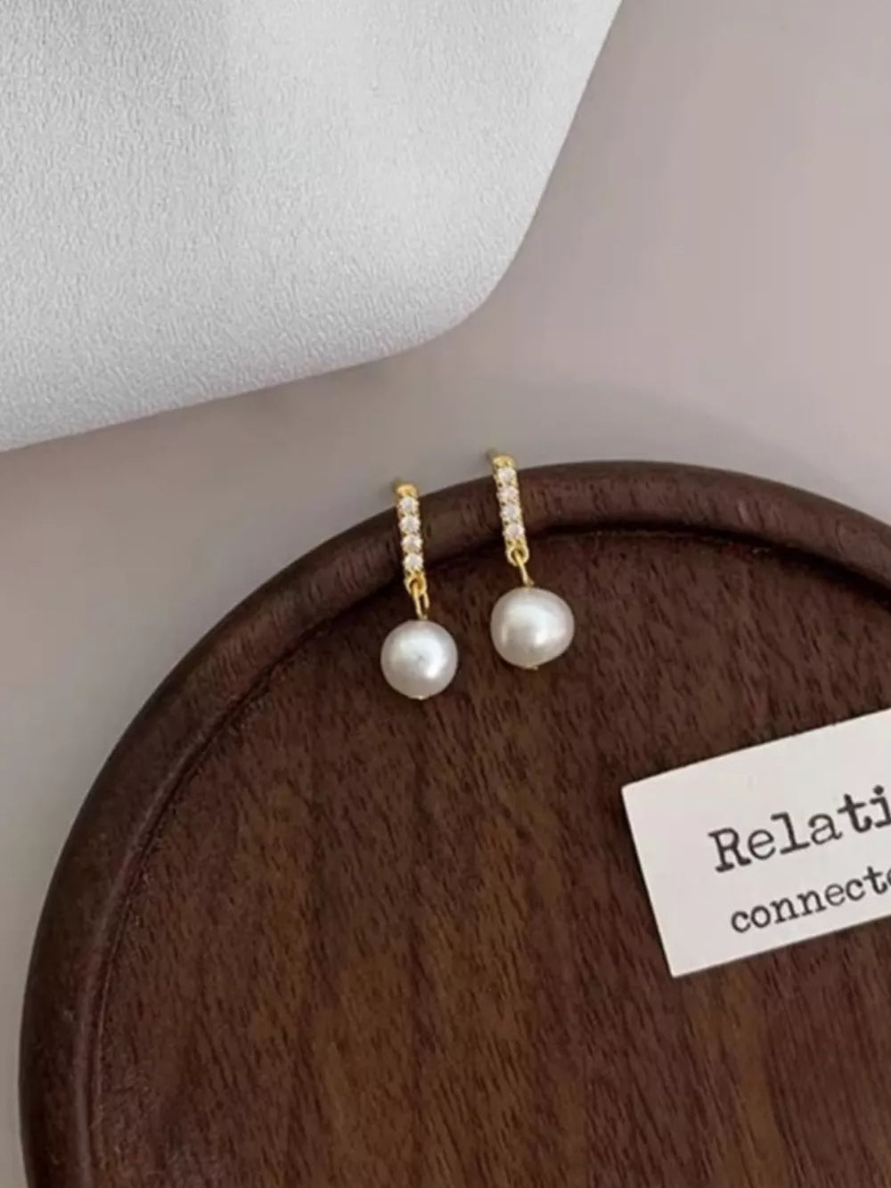 earrings in ivory featuring faux pearl and drop fit
