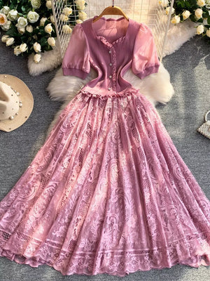 Pink lace puff sleeve dress with button front and ruffled neckline.