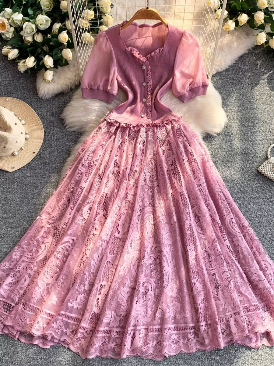 Pink lace puff sleeve dress with button front and ruffled neckline.