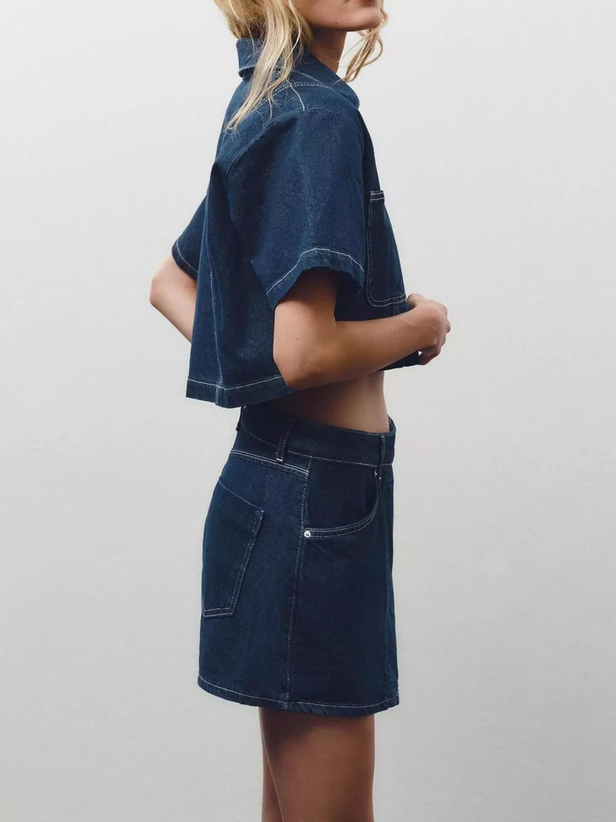 Dark blue cotton cropped button-up top and skort set with contrast stitching.