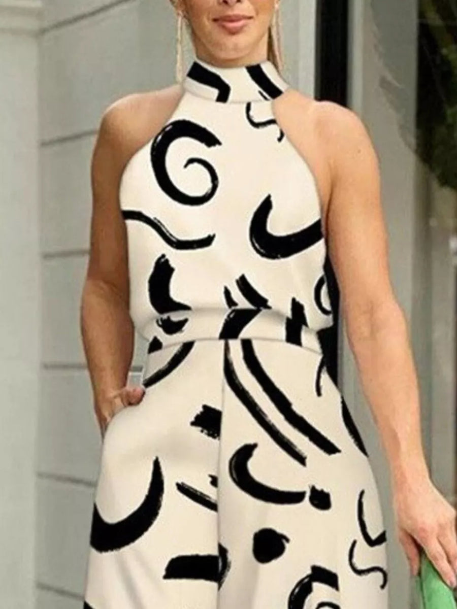 White halter neck romper with abstract black print and pockets