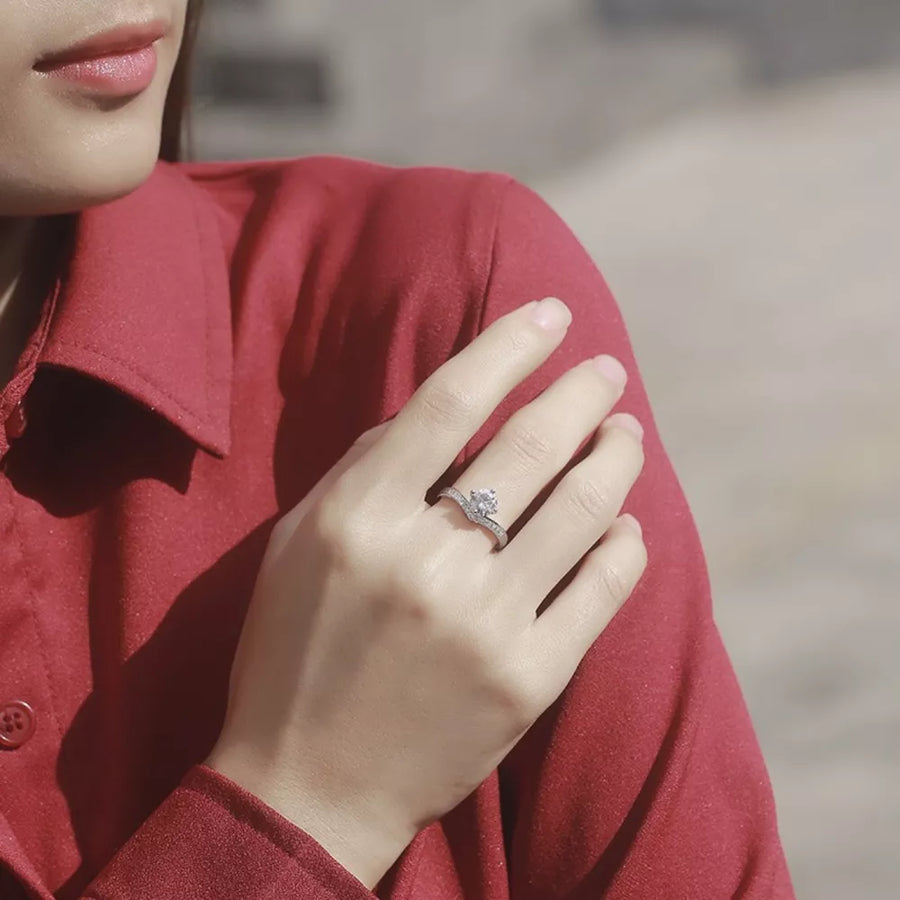 Dazzling Moissanite Sterling Silver Ring with brilliant stone and pave band.