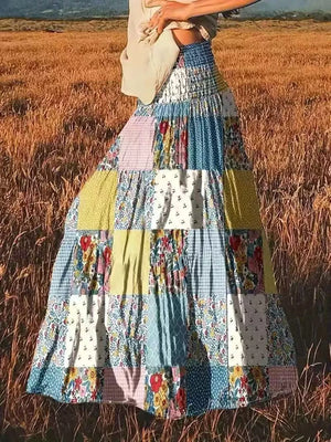 white maxi skirt featuring tiered and patchwork