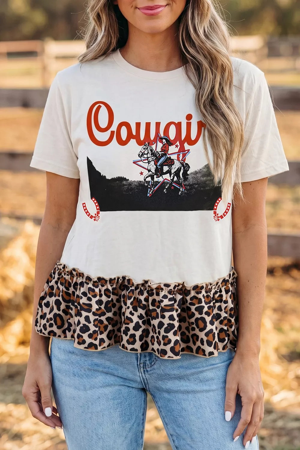 Cowgirl graphic tee with ruffled leopard hem and cotton blend fabric.