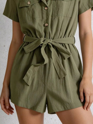 Olive green cotton romper with button-down front, collared neckline, short sleeves, and a tie waist.