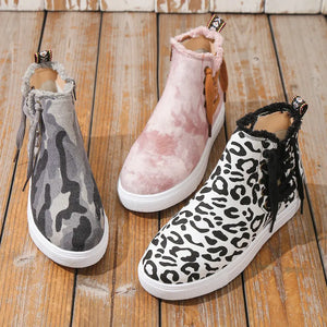Canvas zip-up sneaker booties in green camouflage, blush pink tie-dye, and leopard print.
