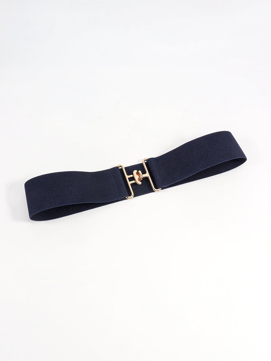 Dark blue elastic belt with sculpted gold buckle detail