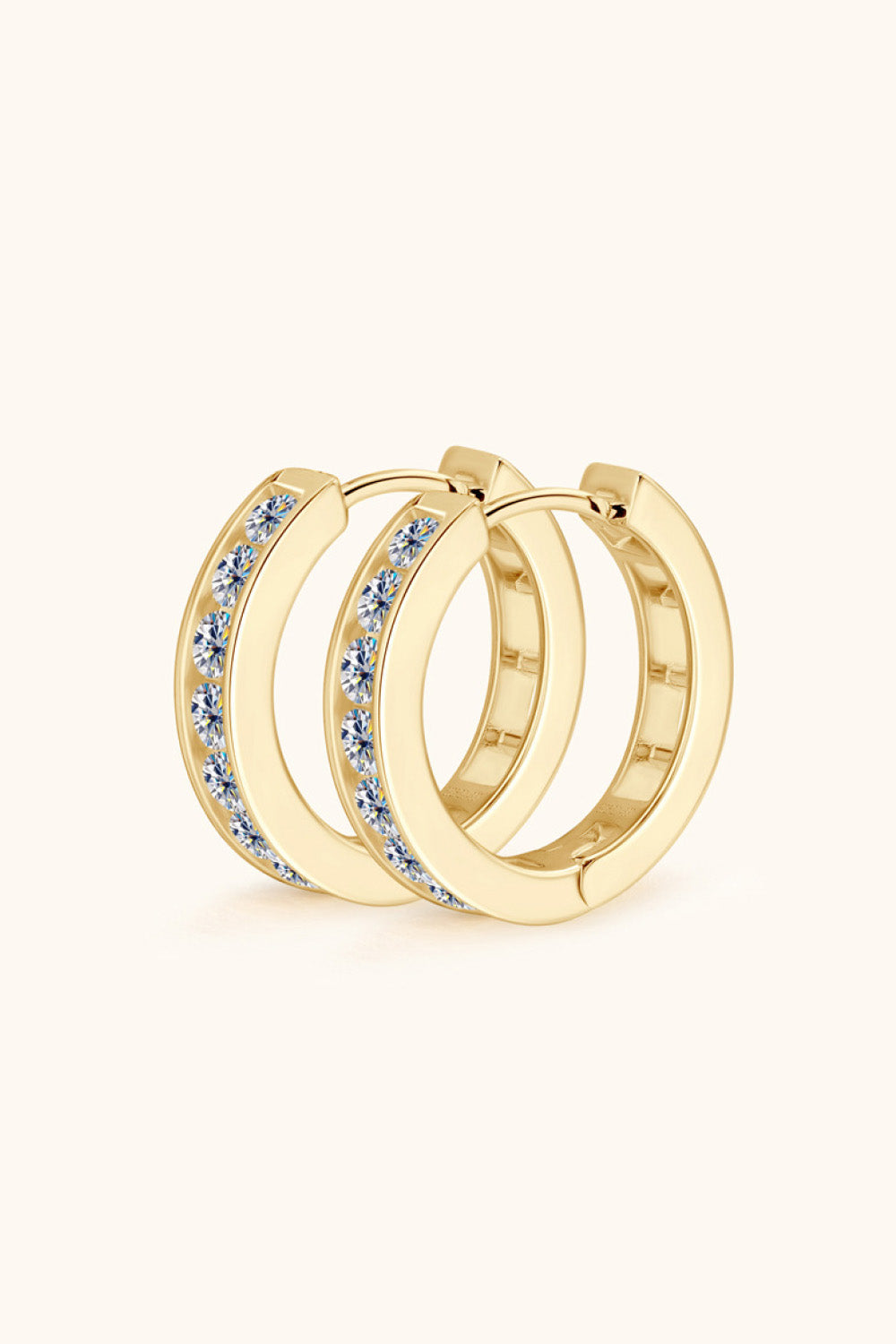 Gold moissanite channel-set hoop earrings with sparkling stones